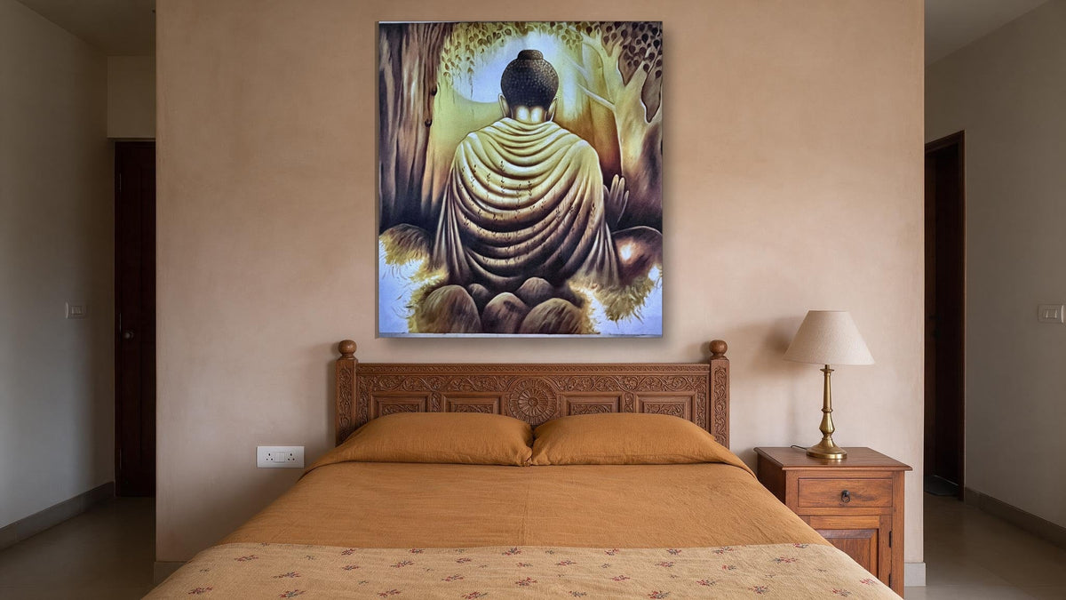 Hand-painted golden Buddha meditation canvas seen from behind beneath a tree, shown in a bedroom