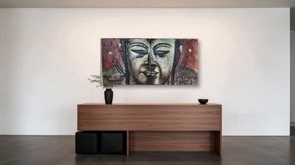 Hand-painted Buddha face diptych in textured relief across two panels, shown in an office reception