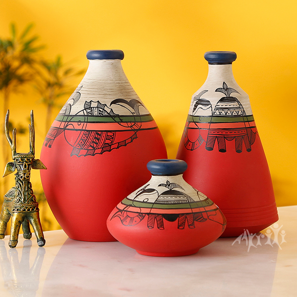 Handcrafted Terracotta Pots Decorated with Madhubani Art, styled on a table