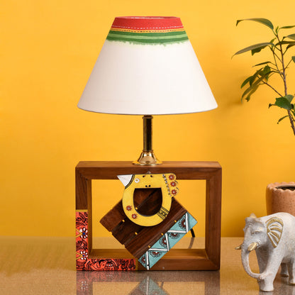Handcrafted Wooden Table Lamp with Tribal Motifs, styled on a side table