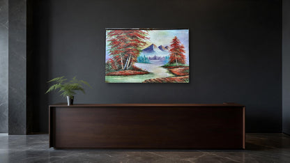 Hand-painted mountain river landscape canvas with red autumn trees and snow peaks, shown in an office reception